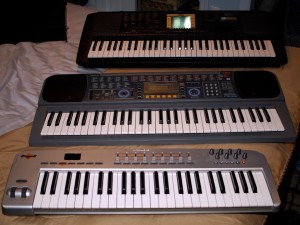 A photo of my three keyboards.  Two are synths, one is just a controller.